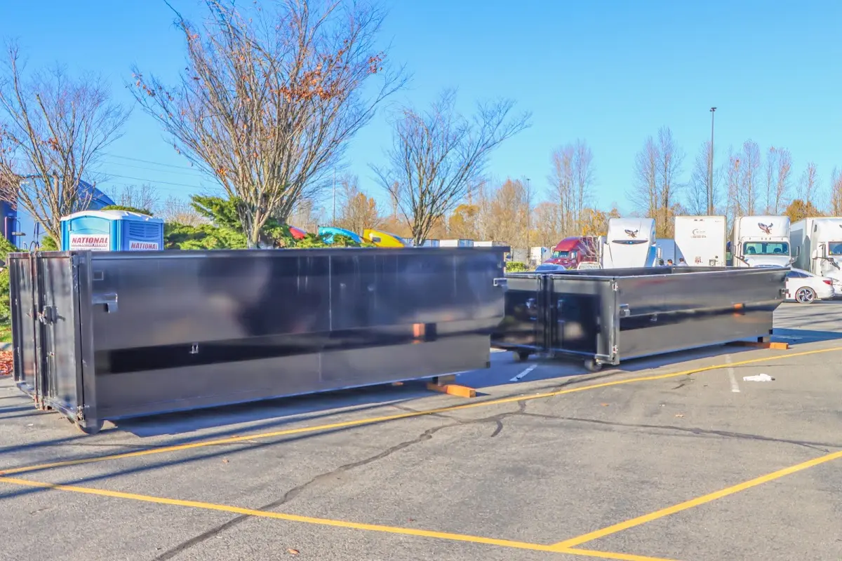 Professional dumpster rental service with roll-off container on residential driveway in Nolensville